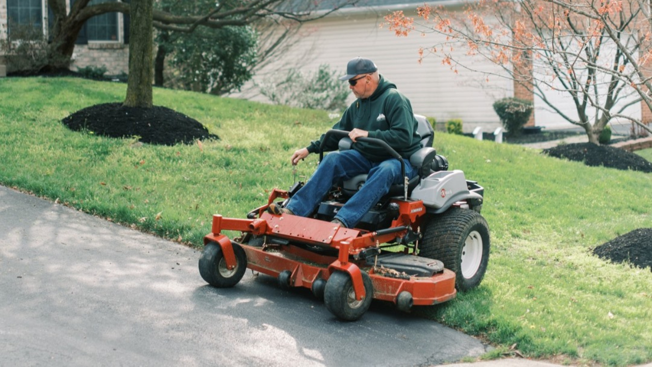 Ron on a riding mower on a property turning around